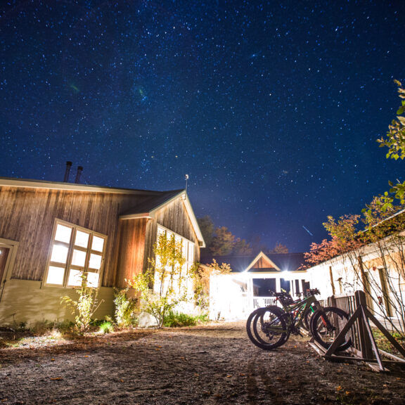 Stratton Brook Hut at night in the summer.