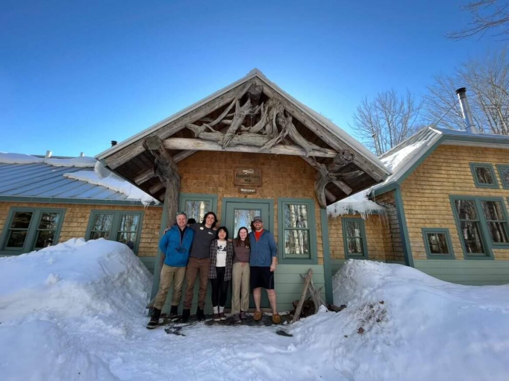 Hut crew in front of Flagstaff Lake Hut