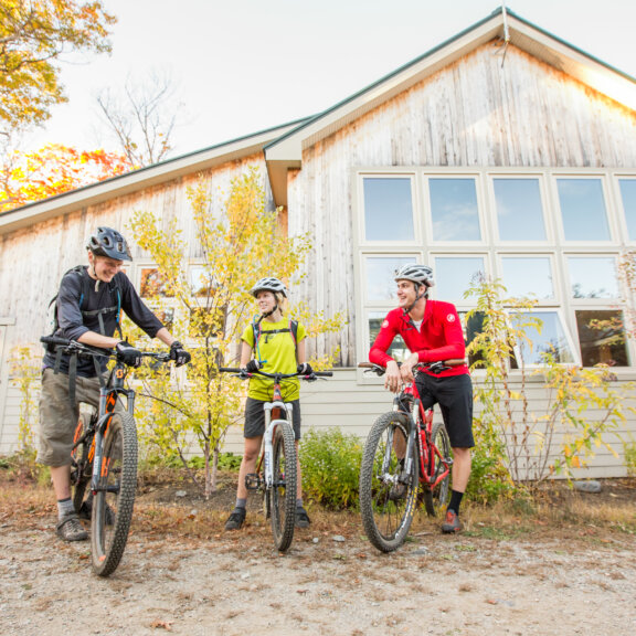 Mountain bikers outside Stratton Brook Hut.