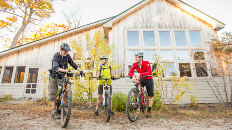 Mountain bikers outside Stratton Brook Hut.