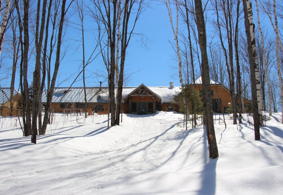 Flagstaff Lake Hut main entrance in winter.