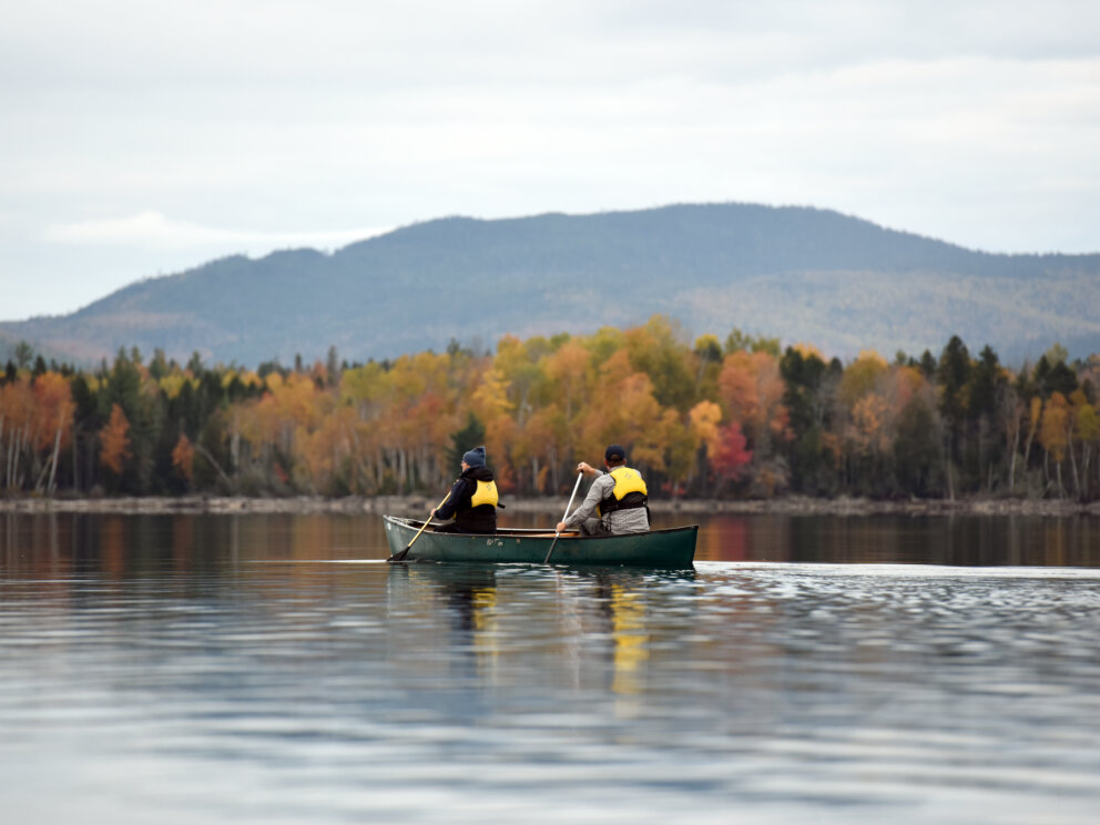 Canoeing on Flagstaff Lake Hut in autumn