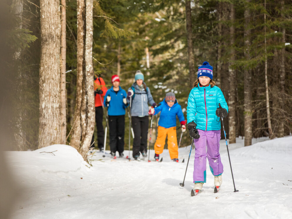 Family skiing on the Maine Hut Trail to Flagstaff Lake Hut