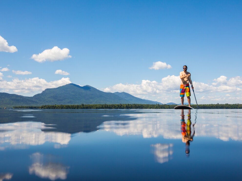 Paddle boarding on Flagstaff Lake Hut