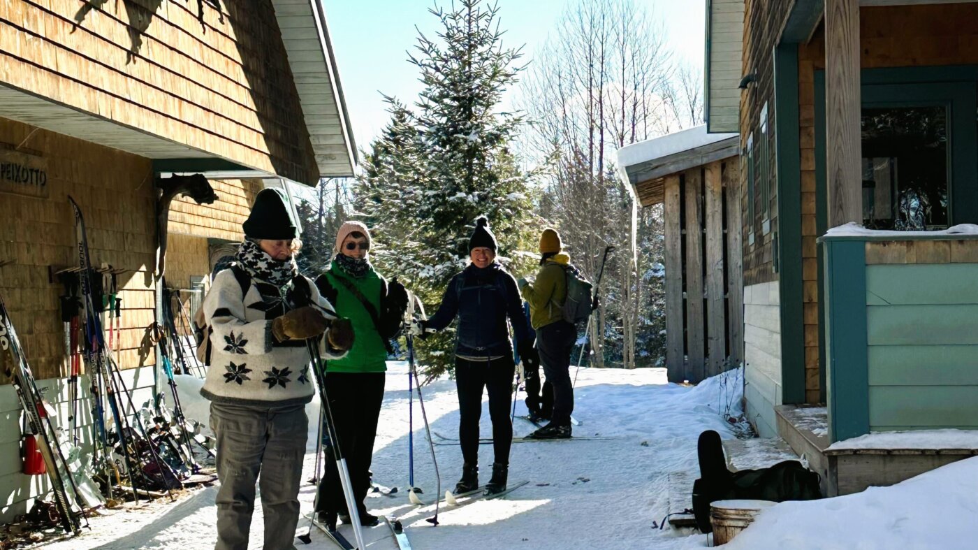Skiers arriving at Flagstaff Lake Hut.