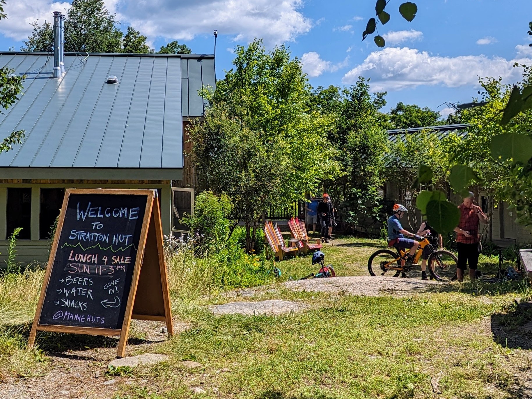 Mountain bikers at Stratton Brook Hut for a lunch event.