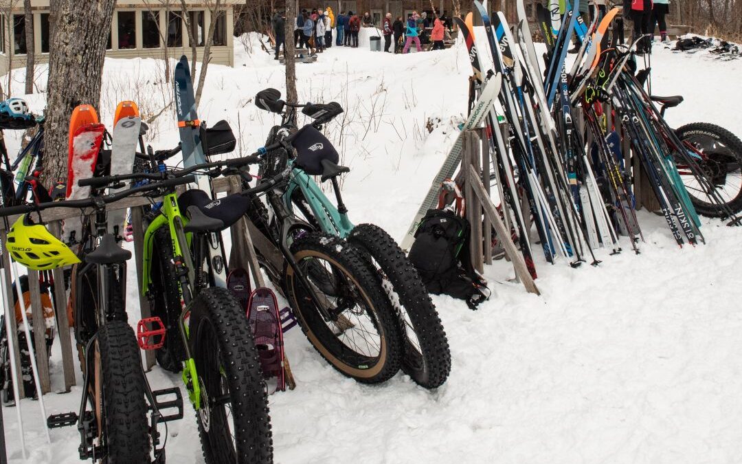 Fat bikes and skis on the rack outside Stratton Brook Hut for the Alpine Feast.