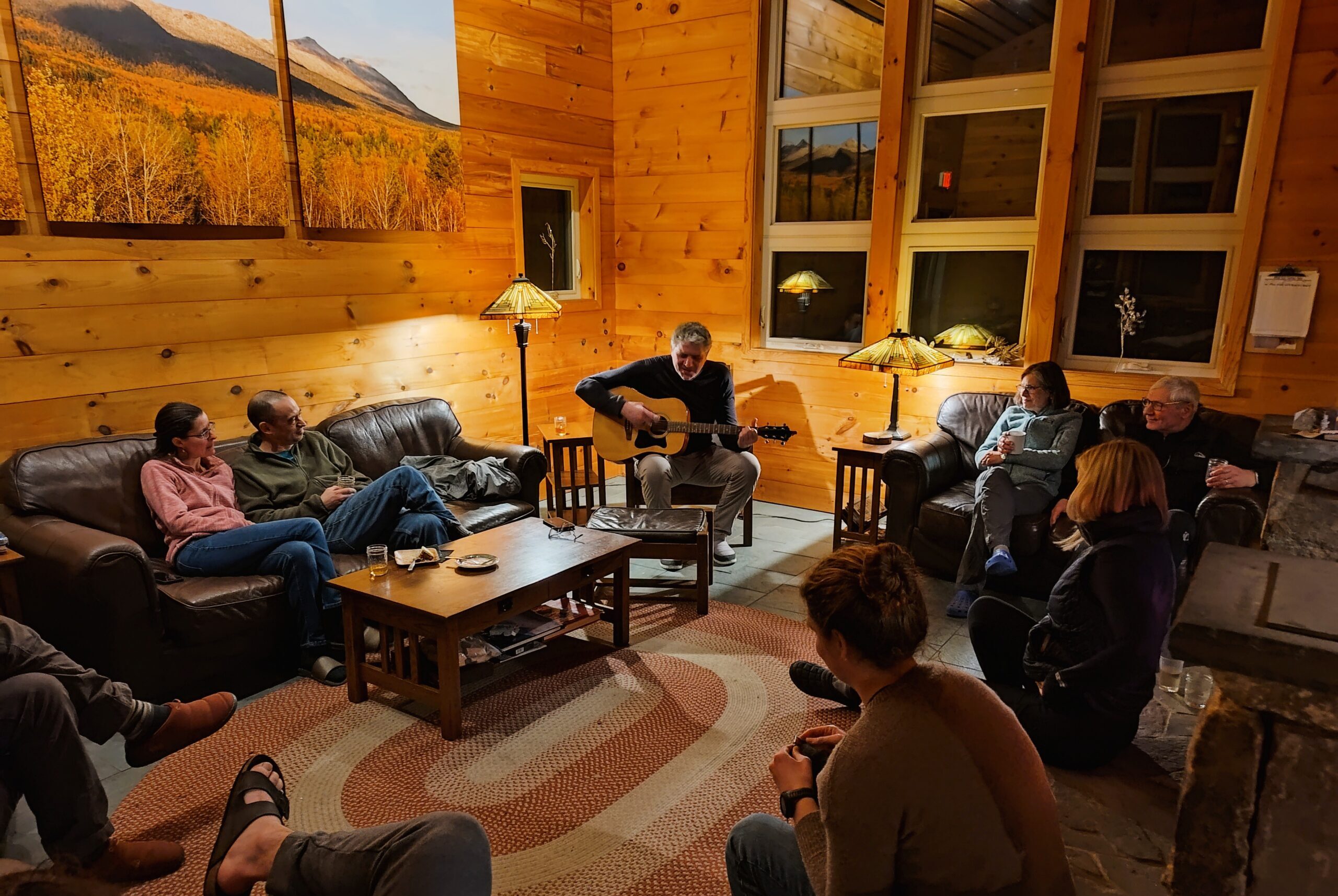 Guitar playing in the Stratton Brook Hut lounge during the Alpine Dinner.