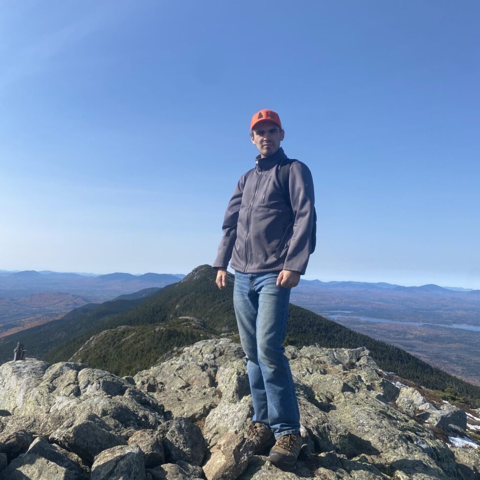 Maine Huts Hut Staff on top of a mountain