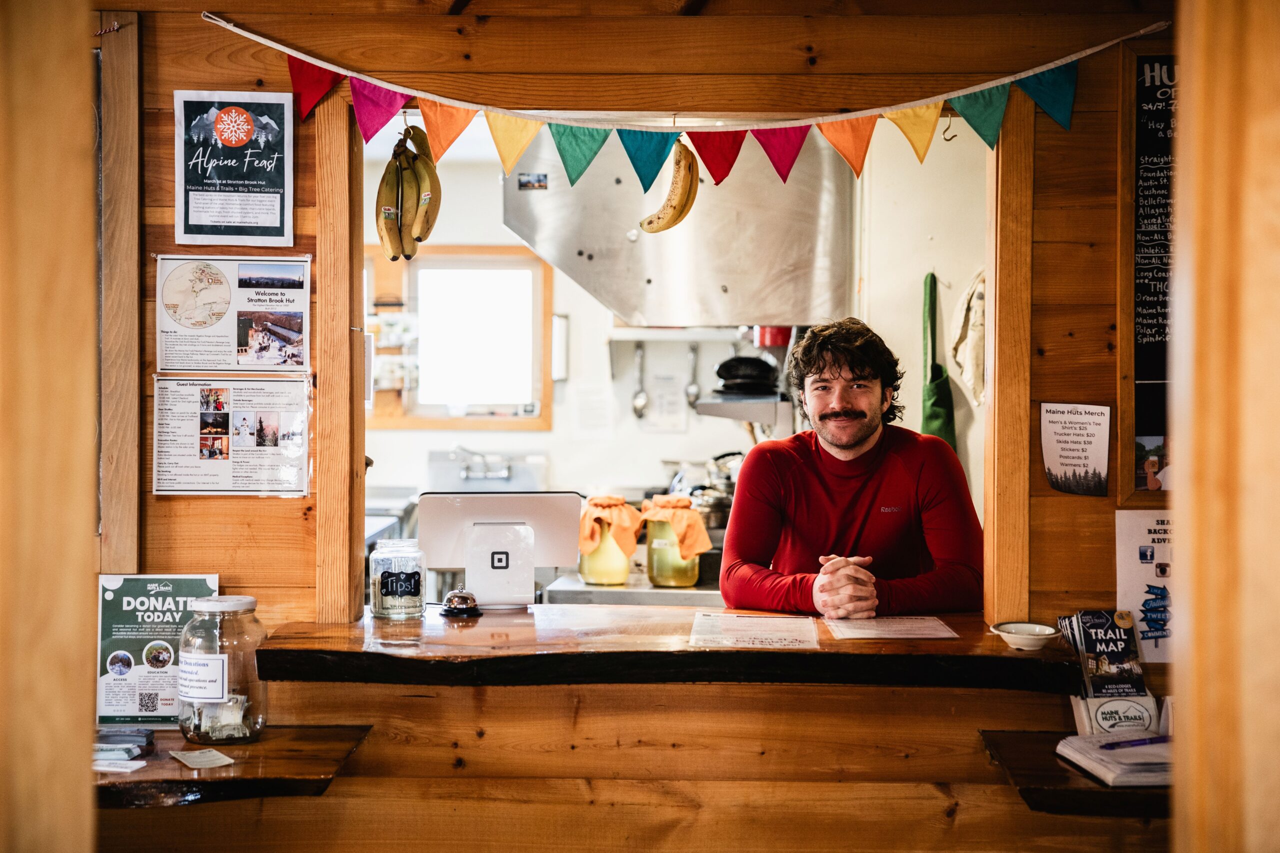 The welcome window with hut staff at Stratton Brook Hut