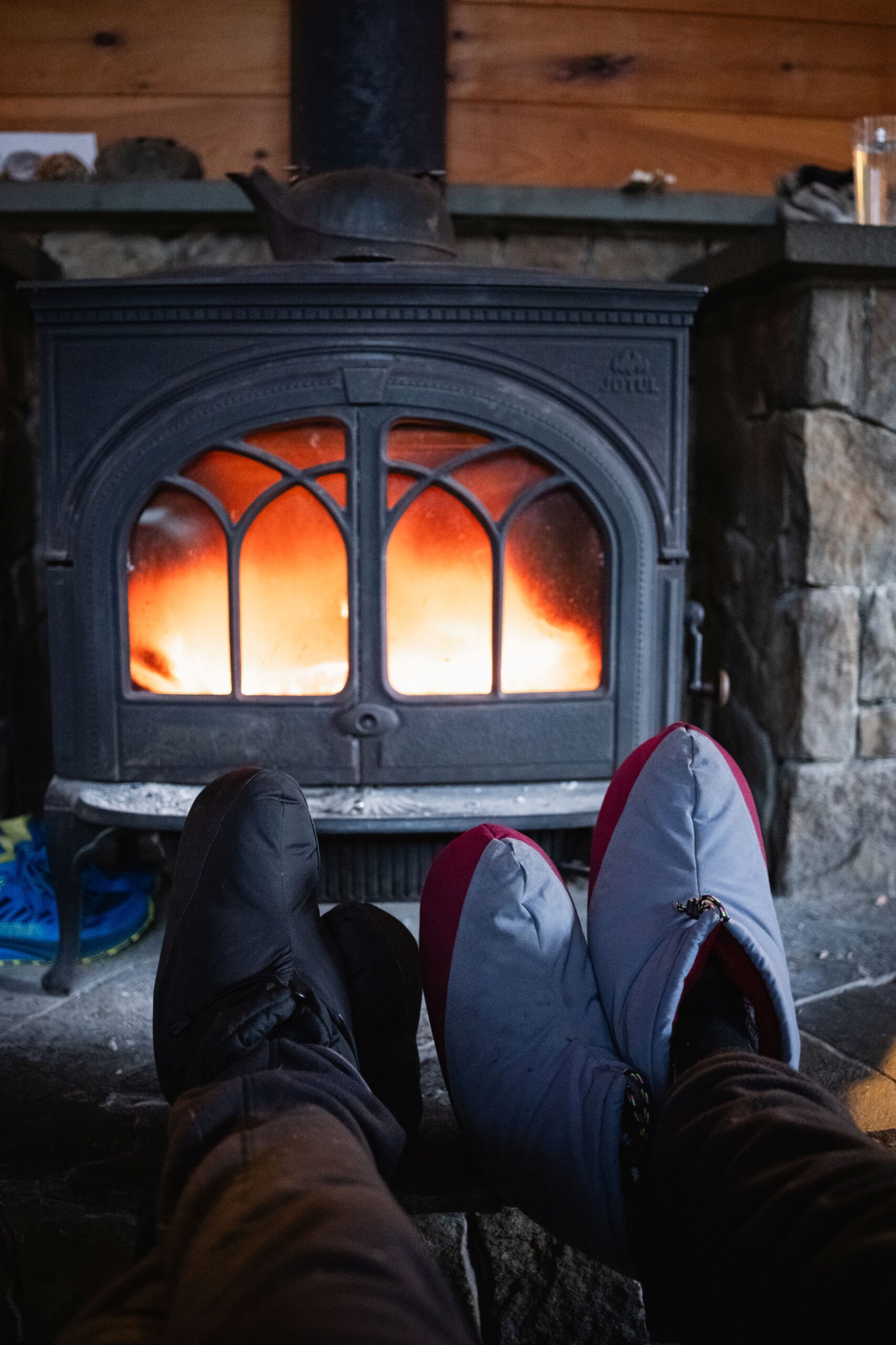 Warming feet by the fire at Poplar Hut
