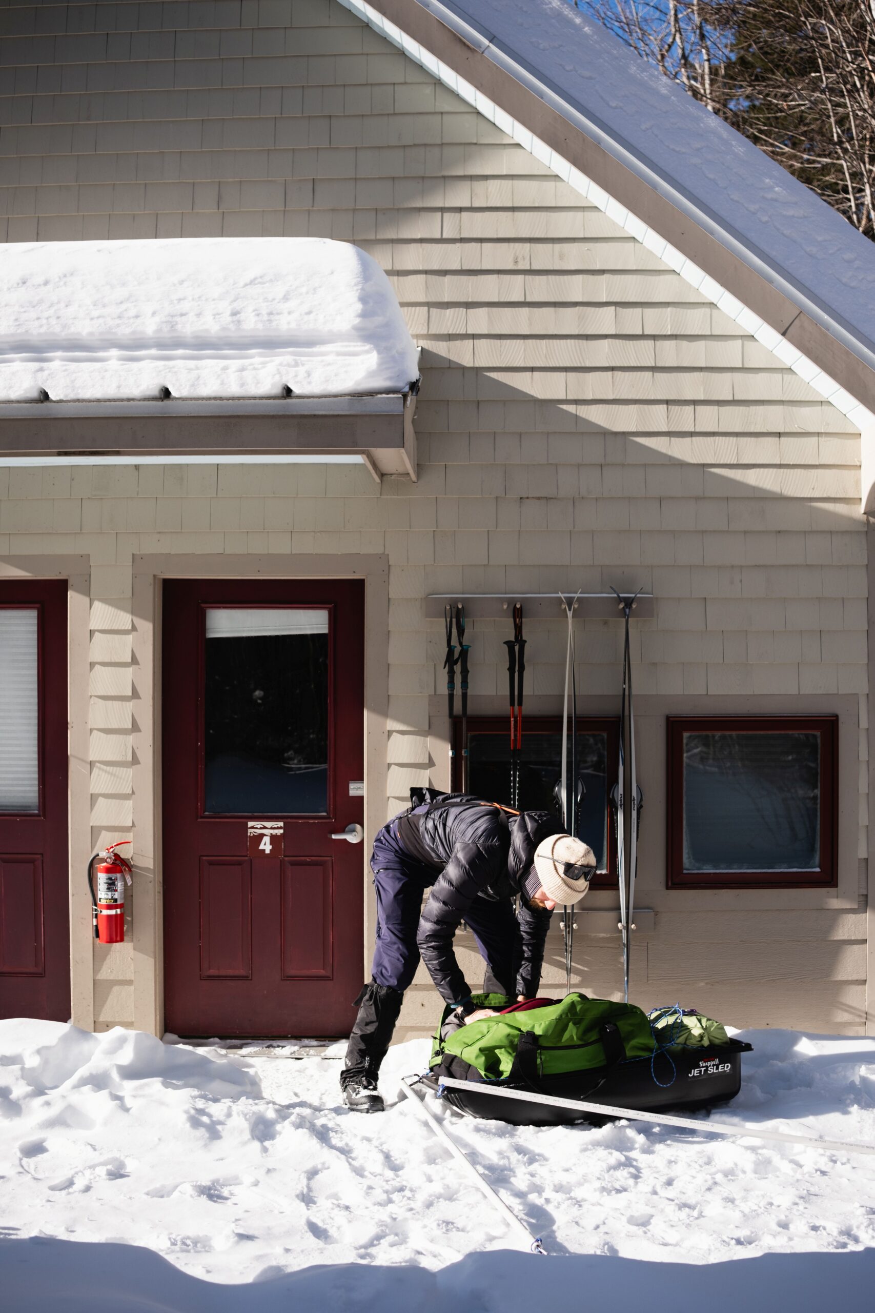 Getting ready to depart outside of the Poplar Stream Hut bunkhouse.
