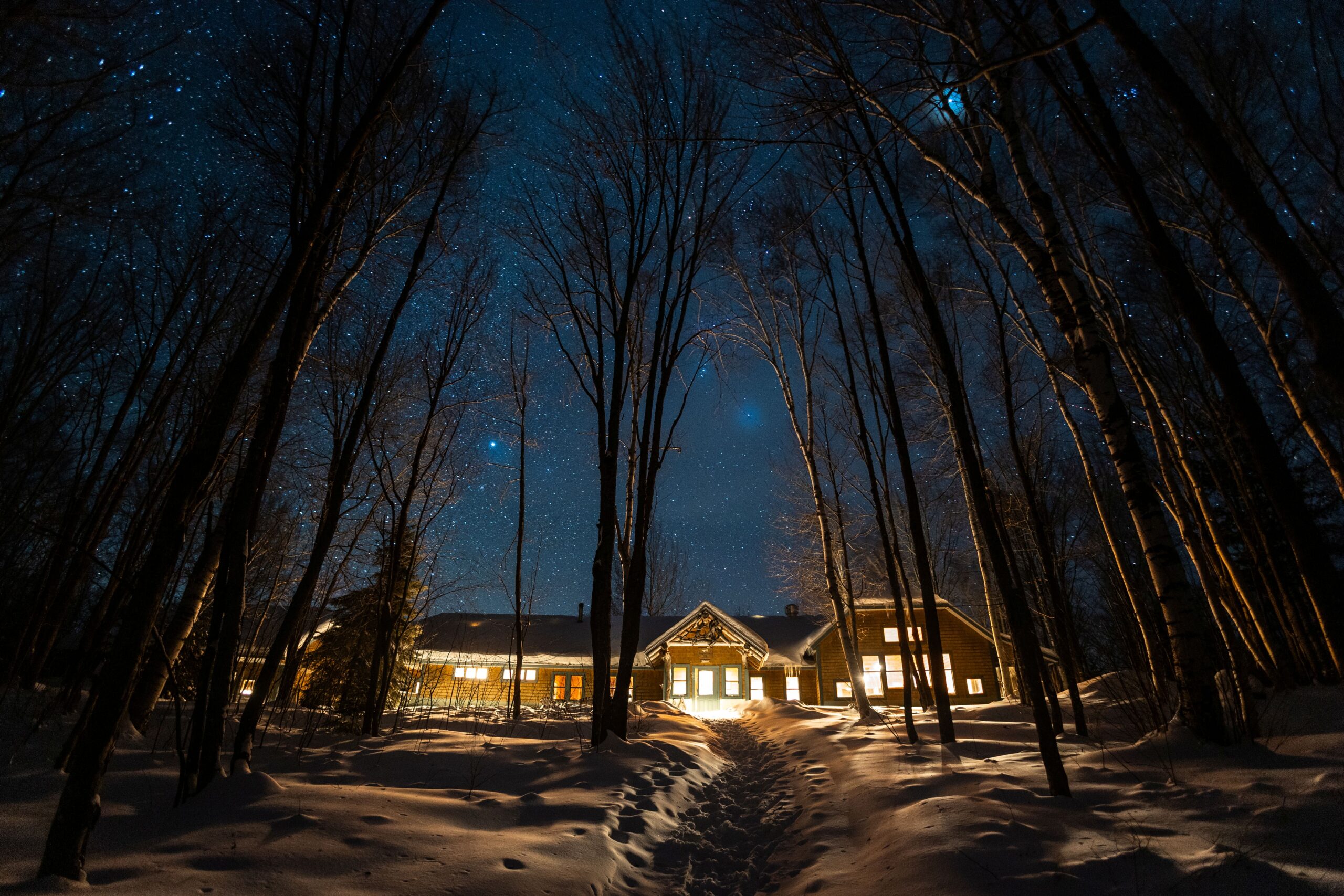 Flagstaff Lake Hut night shot with stars in winter.