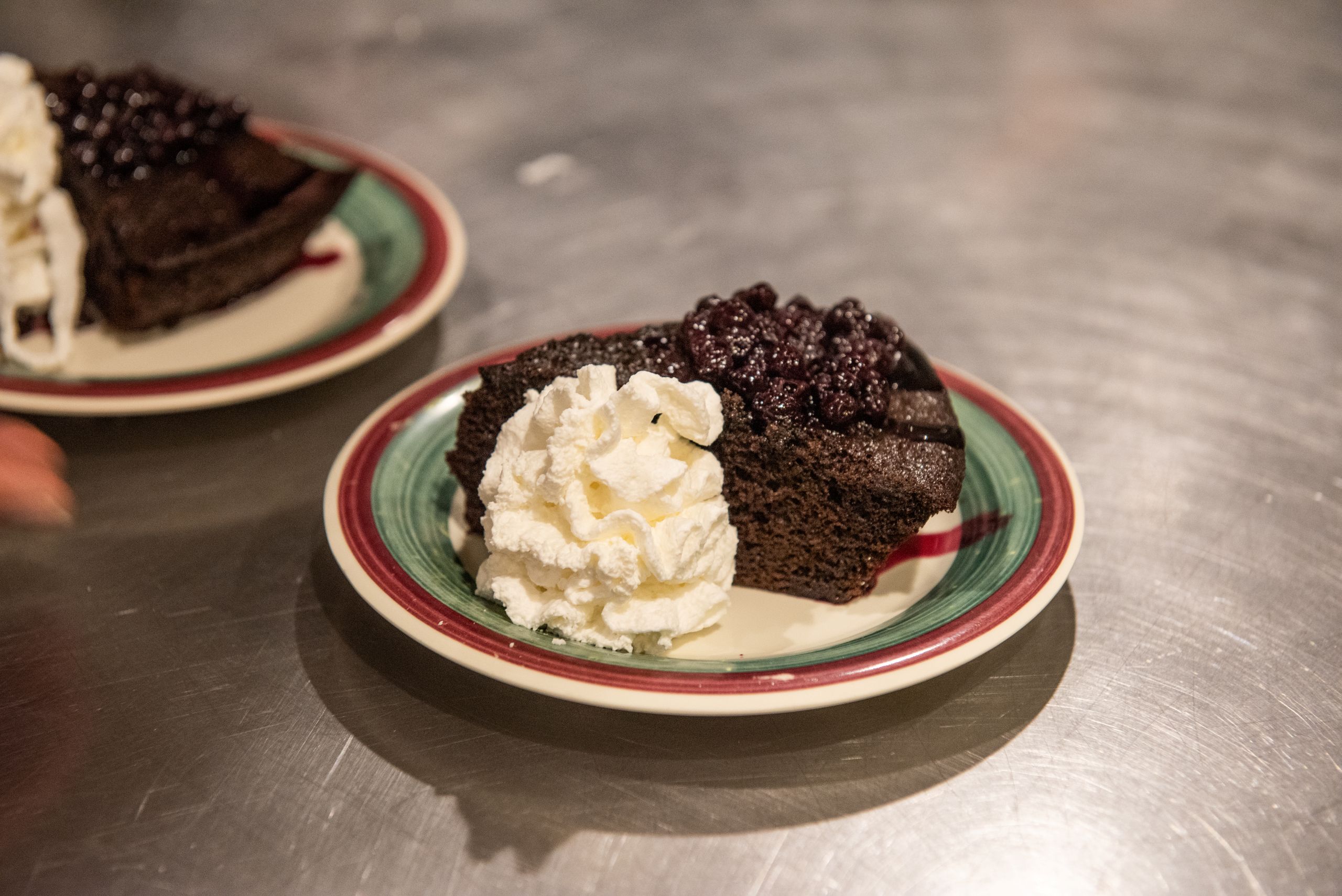 Chocolate cake with blueberries and whipped cream