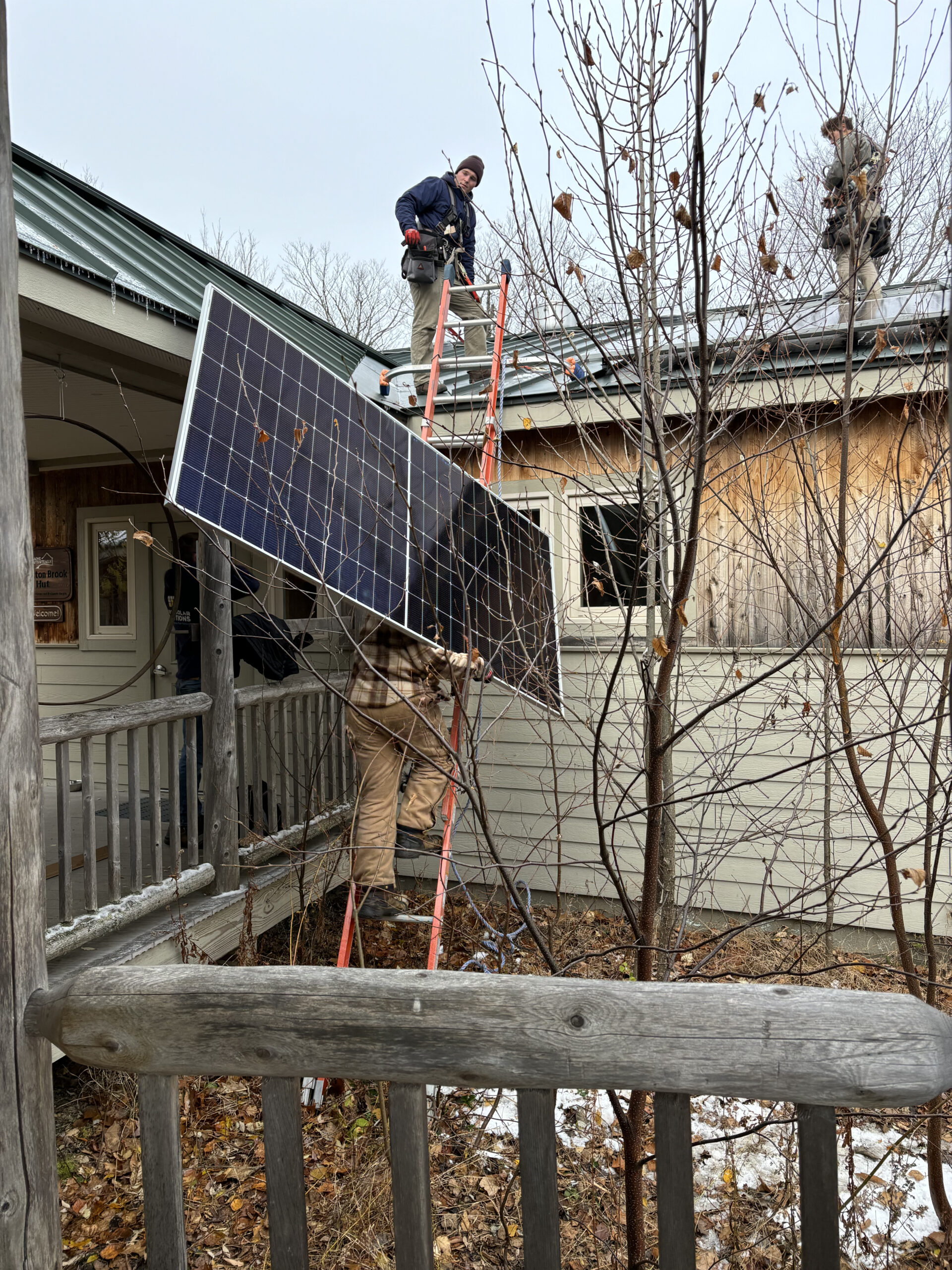Solar panels being installed at Stratton Brook Hut