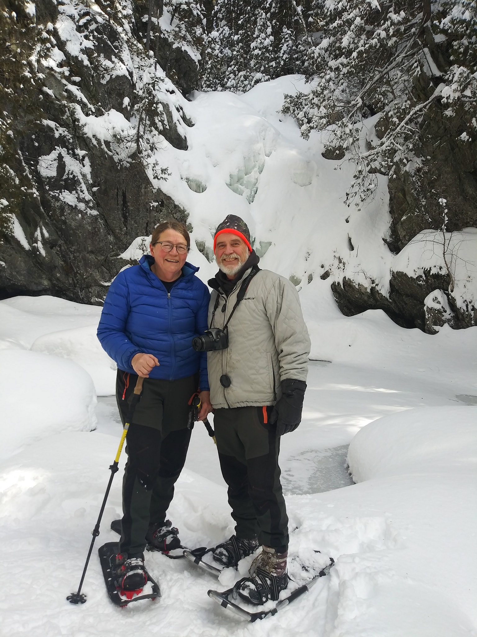 Volunteers Karen Wilcox and Jon LaRochelle at the waterfall